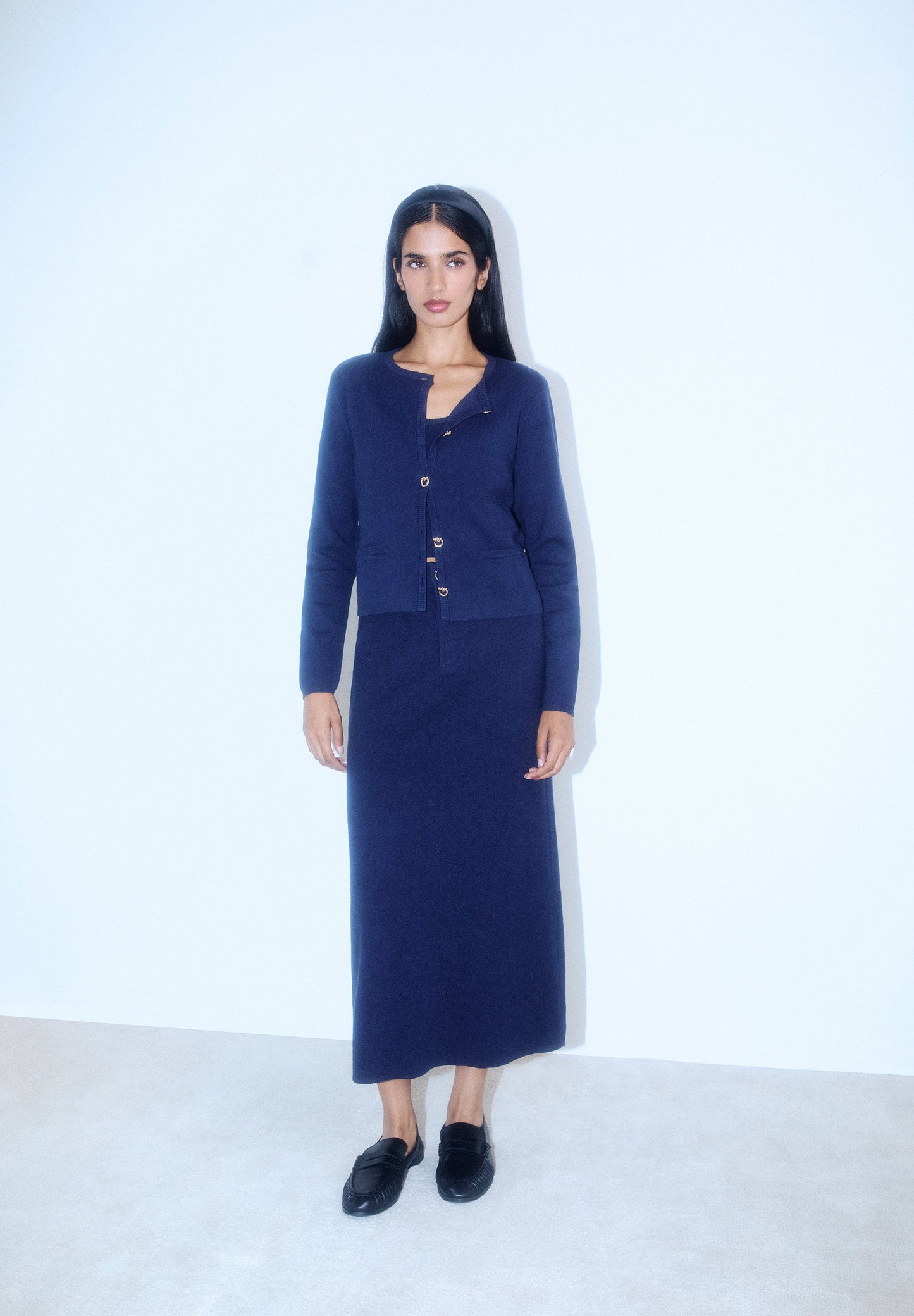 FALDA MIDI PUNTO BOTÓN